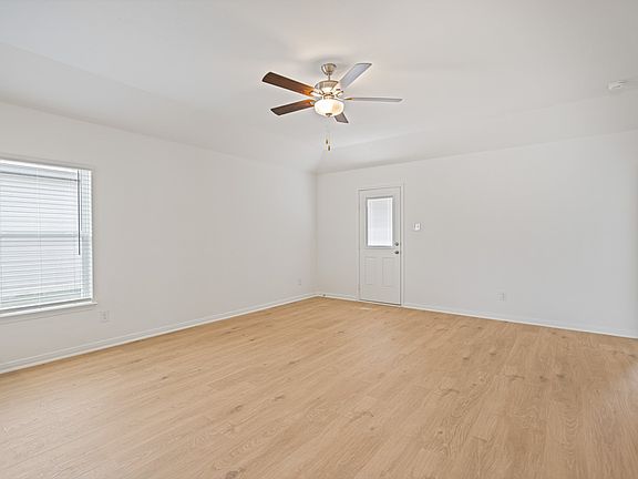 The family room offers great natural light and soaring ceilings.