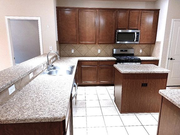 Chef's delight kitchen. Gas Stove. Island. Abundant cabinets & countertops. Appliances updated.