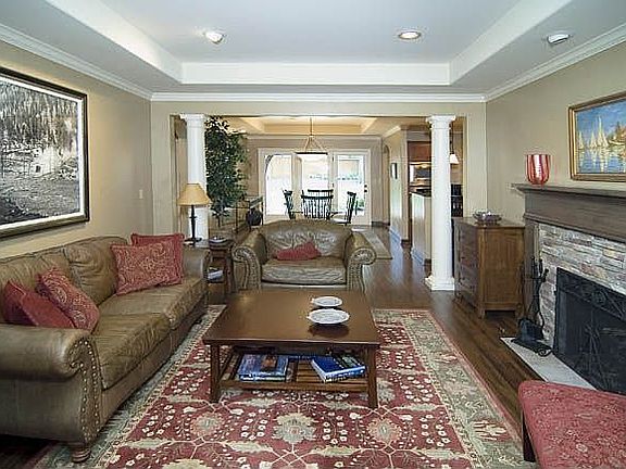 9' ceilings, recessed lighting, tuscan columns and solid maple mantle.