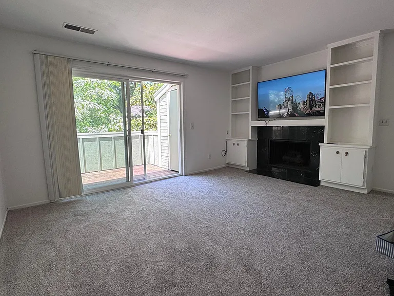 Living room with gas chimney (TV not included)
