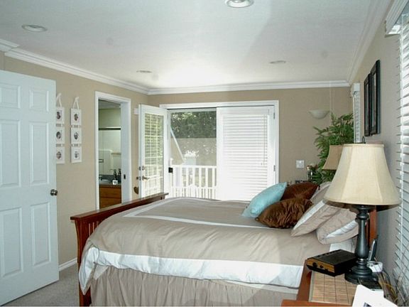 Spacious dining room has French doors out to entertainment deck, pool, hot tub and great backyard. Perfect kitchen with large skylight and large window brings in lots of light. Easy access to deck makes this perfect for entertaining. Adjacent pantry for great storage.