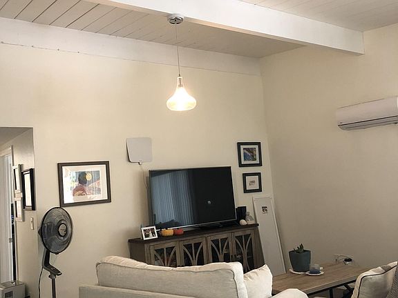 Modern lighting, natural light, high ceilings add volume