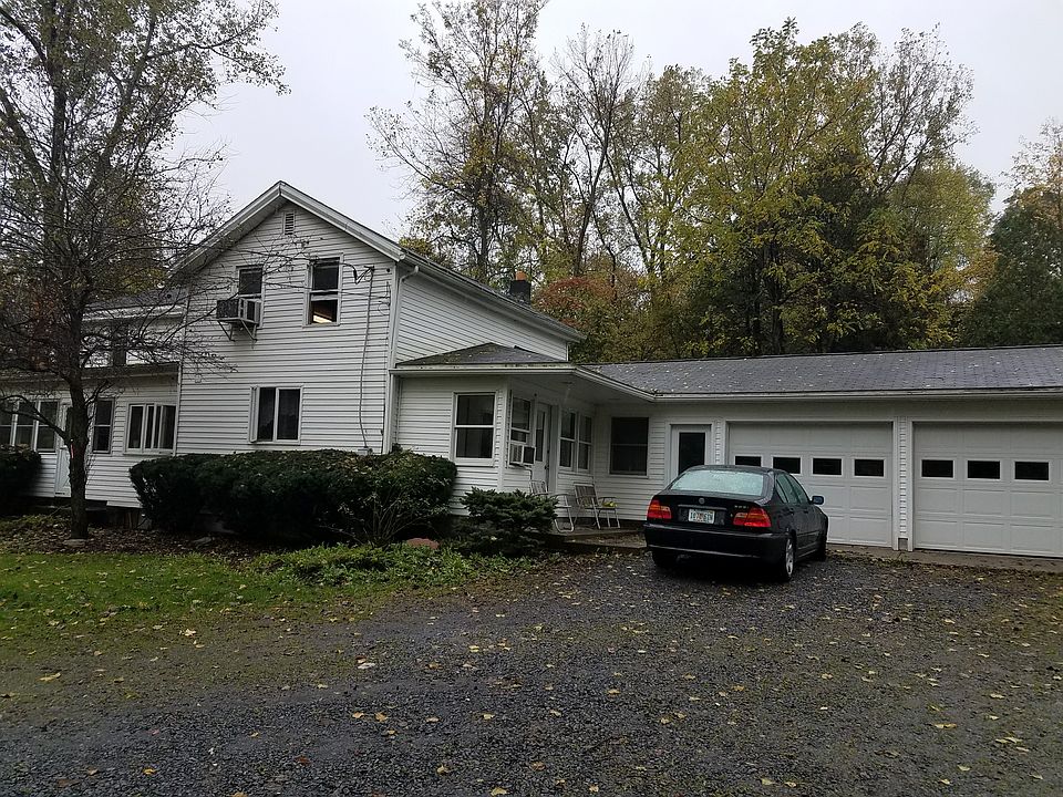 Front of house with garage.