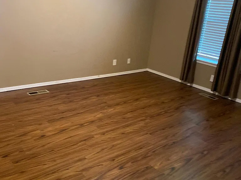 Primary bedroom has vaulted ceilings and new vinyl plank floors as do other downstairs bedrooms and hallways.