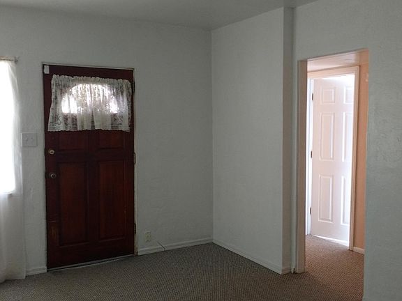 Living room with hallway and partial view of front bedroom
