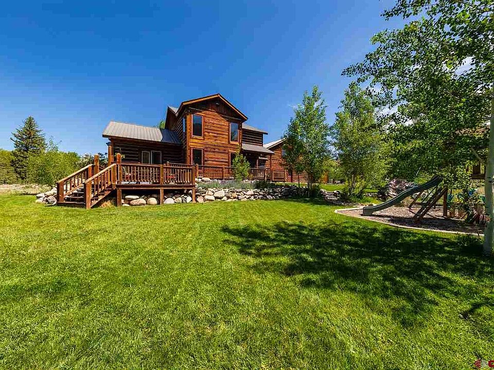 Well maintained lawn, mature trees, playground.  Back deck for relaxing and dinner parties.