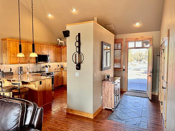 Front door and gourmet kitchen