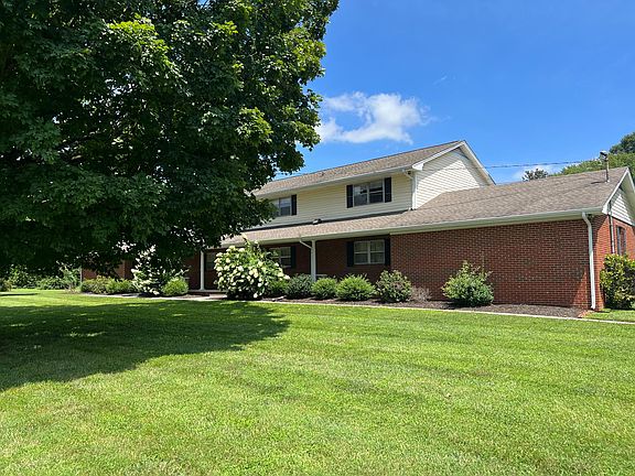 Front exterior. Covered carport in the back. 11610 is upstairs