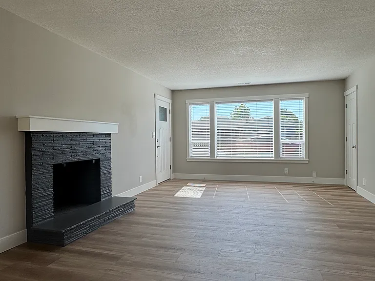 Living room w/fireplace and coat closet
