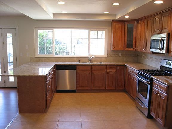 Brand new kitchen with maple cabinets and granite counters