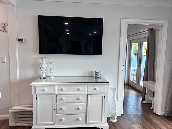 Living area buffet with smart television.