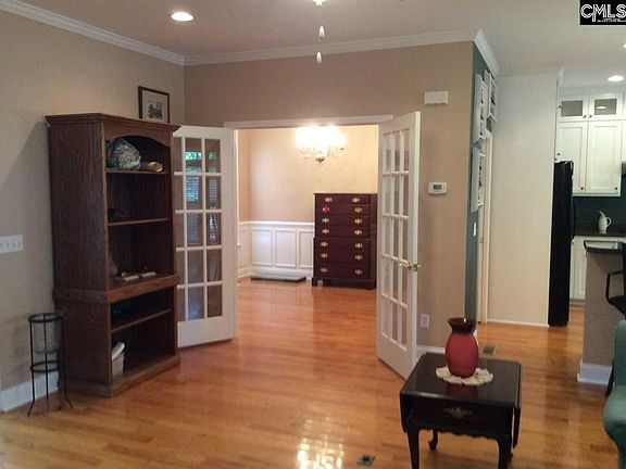 French doors separate the Living Room from the Formal Dining Room.