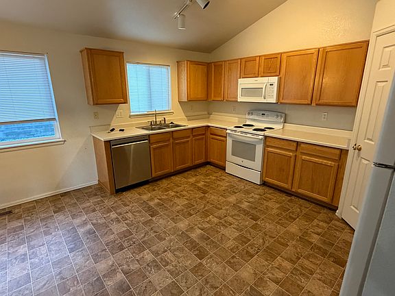 Eat in kitchen, windows have view of backyard