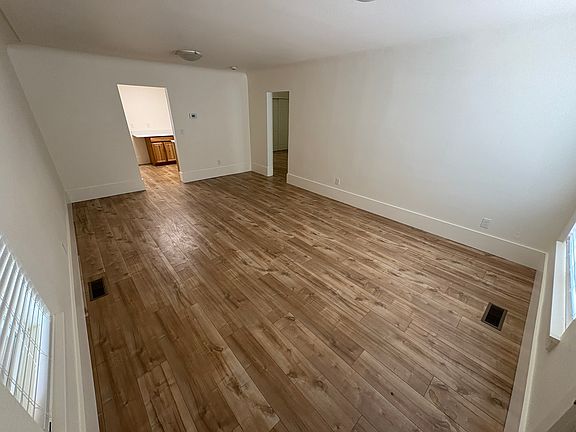 View from front door looking toward kitchen. On the right is the doorway leading to the bedrooms/bathroom