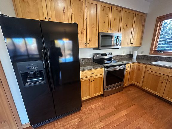 Kitchen with lots of storage, and pantry closet, fridge, dishwasher, oven, and microwave.