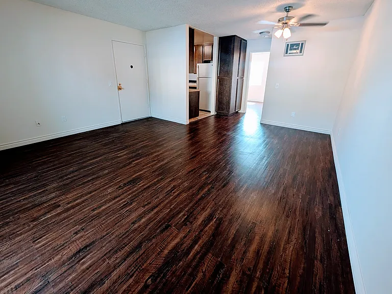 Living/dining room, viewed from patio area.