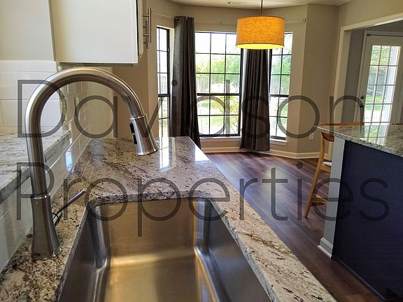 Brite, open kitchen and dining room.