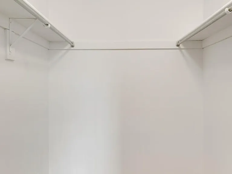 Experience the luxury of ample storage space with this elegant walk-in closet. Experience the luxury of ample storage space with this elegant walk-in closet.