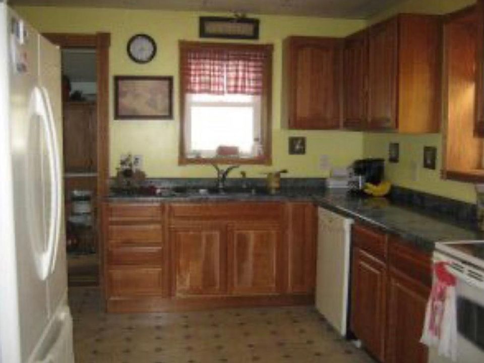 Cherry kitchen cabinets.