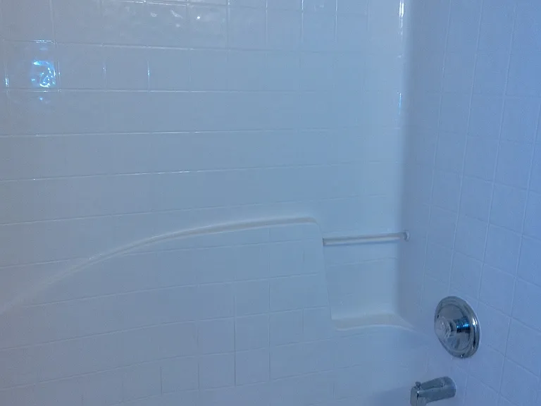Shower bathtub combo in upstairs Hallway.