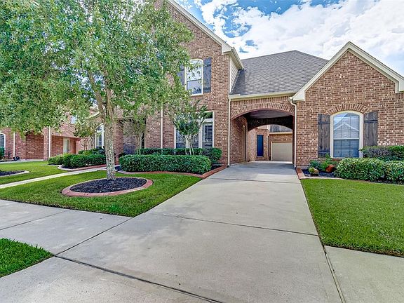 Elegant elevation with a 3 car garage and a Porte-Cochere.