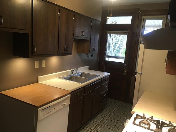 fully equipped kitchen with door to rear covered porch