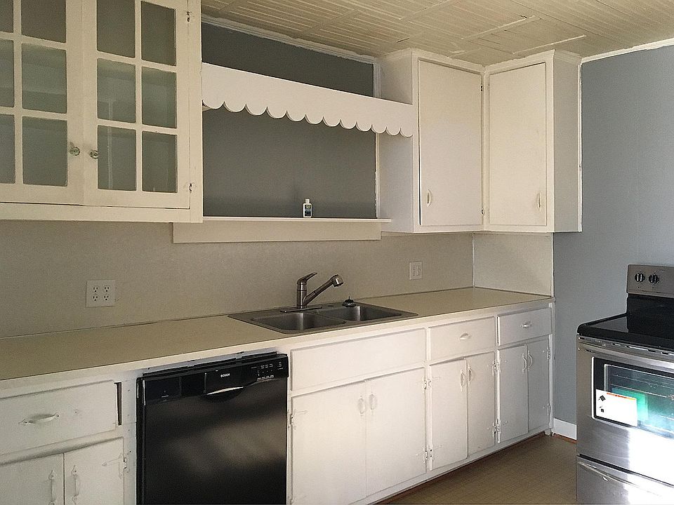 Lots of cabinets and dishwasher with Stainless Steel refrigerator and range