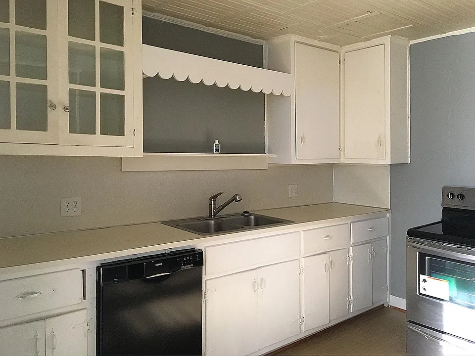 Lots of cabinets and dishwasher with Stainless Steel refrigerator and range