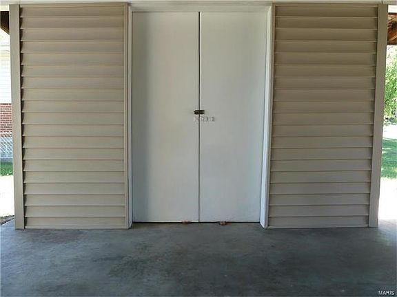 The carport storage building.