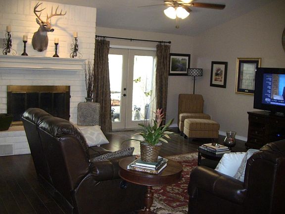 Living room with French doors to the enclosed patio & back y