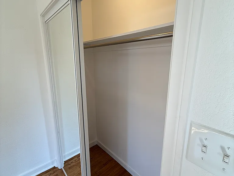 Large Primary Bedroom mirrored closet