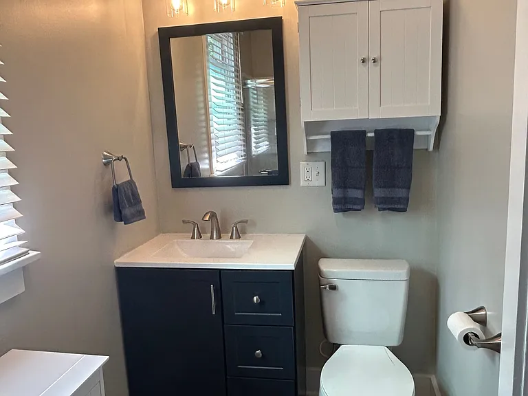 Completely new matching vanity and mirror that ties perfectly with the wall cabinet.
