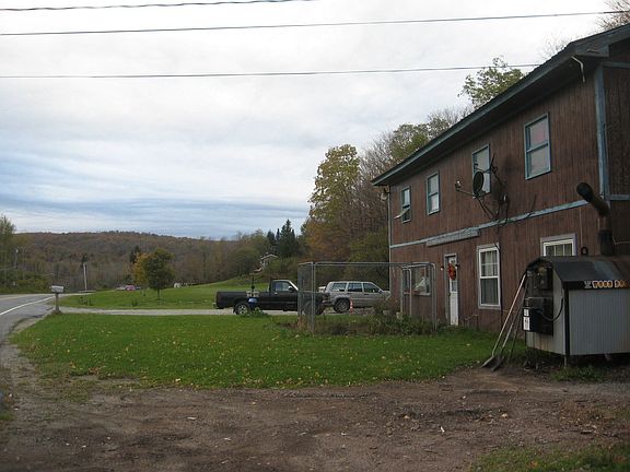 Taken from garage driveway looking over lawn to large driveway