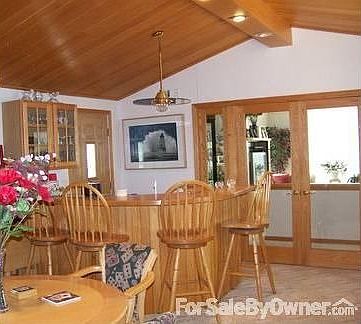 bonus room/bar/game room
						:
						solid oak! with brick fireplace