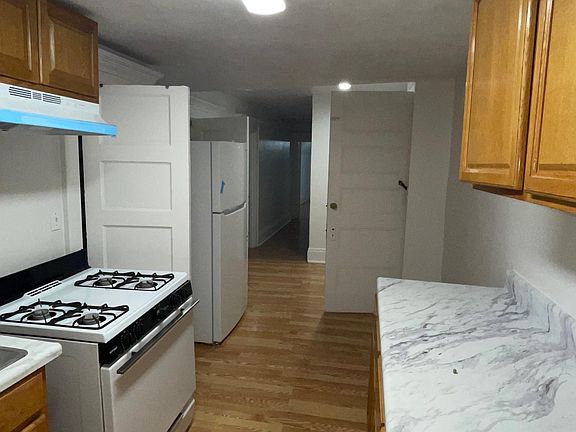 View of the hallway from the kitchen.
