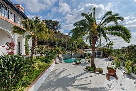 Outdoor patio is the perfect backdrop for large parties or intimate poolside dining.