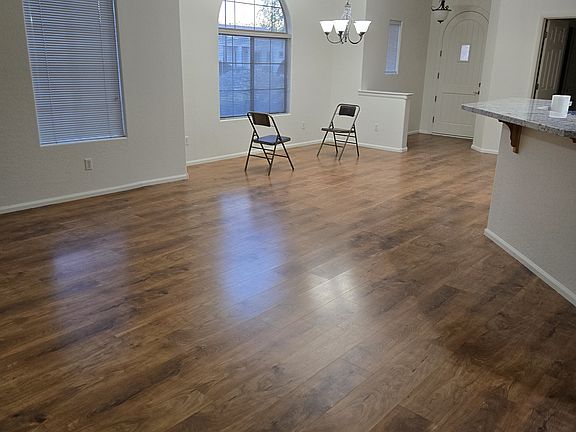 Family room from back patio to front door - kitchen to right - note dining area marked by chairs