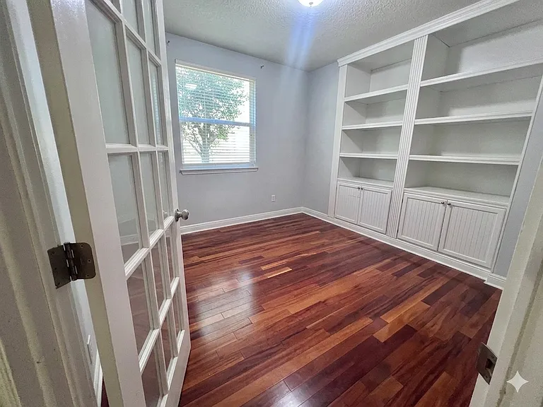 Office with French Door and Built-in Bookcase - Empty