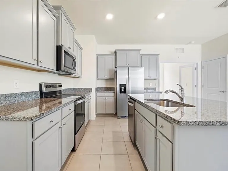 Kitchen includes garbage disposal