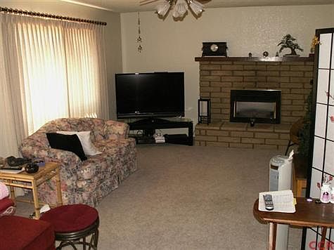 Living Room with brick fireplace