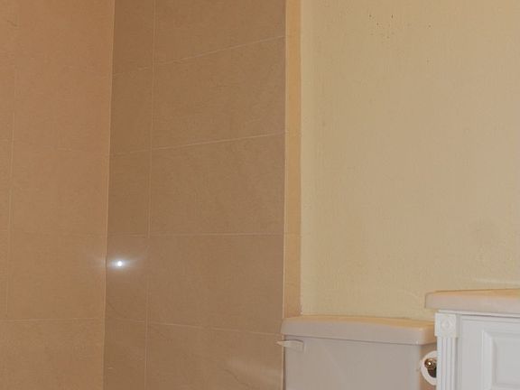 Simple and Elegant Conveniences. Italian Porcelain in Bathroom with Tub