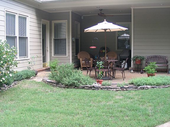 Covered and open patio of your back yard oasis in the middle of the city.