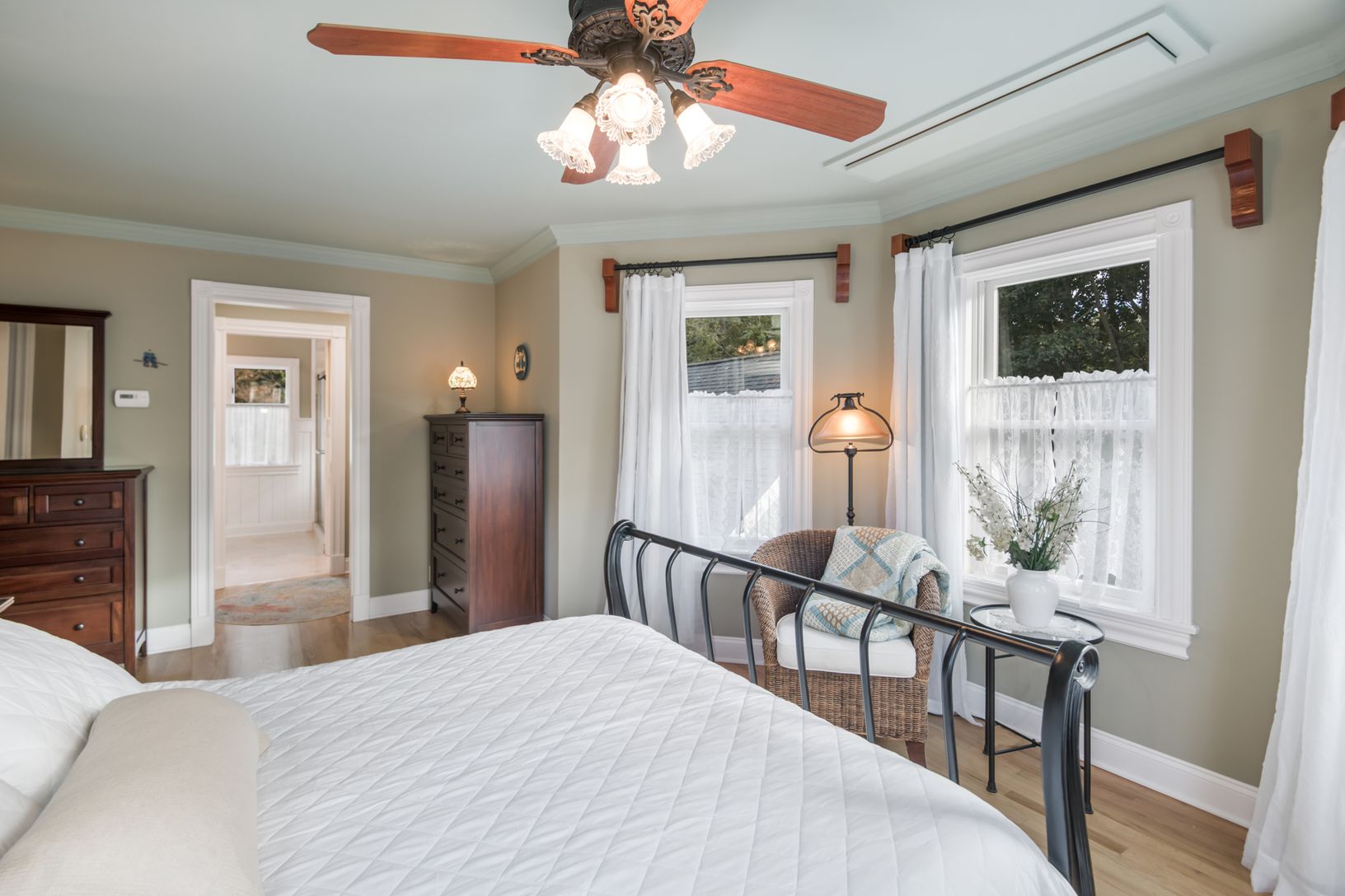  Primary Bedroom En Suite. A Flat Screen Television Lowers from Ceiling in Front of Bed