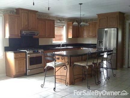 remodeled kitchen : Hickory cabinets with great features, granite tile,3 year old s/s appliances,