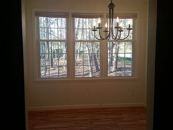 Dining room with view of woods