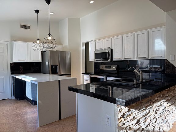 Lots of storage with stainless steel appliances