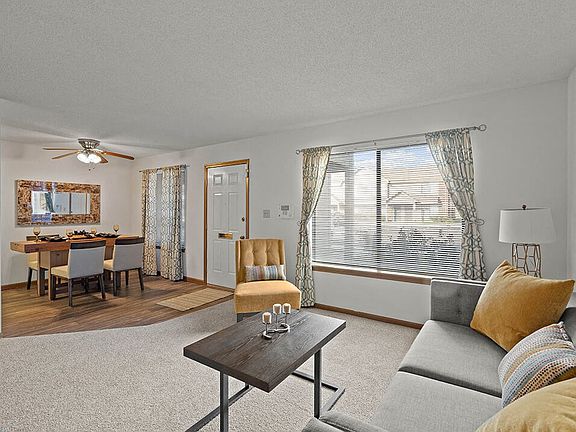 Carpeted Living Area with Large Window