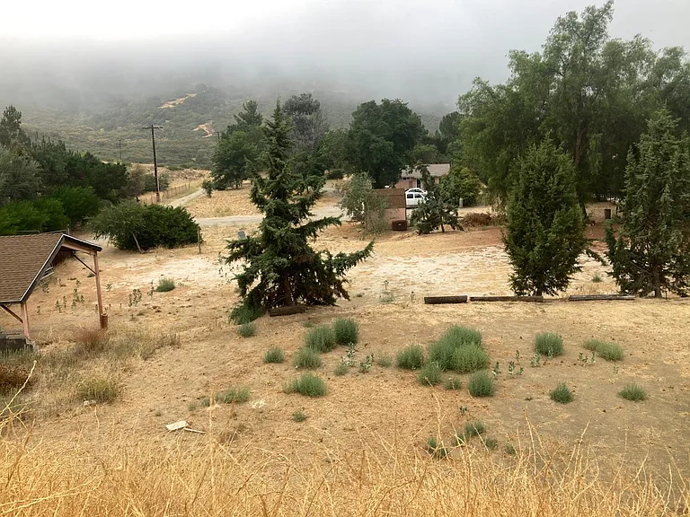 The fog rolling in on a cool summer morning.