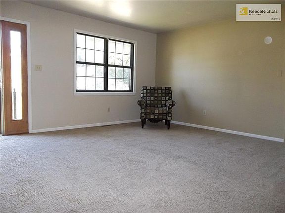 Large Living Room showing Glass Panel adjacent to front door.