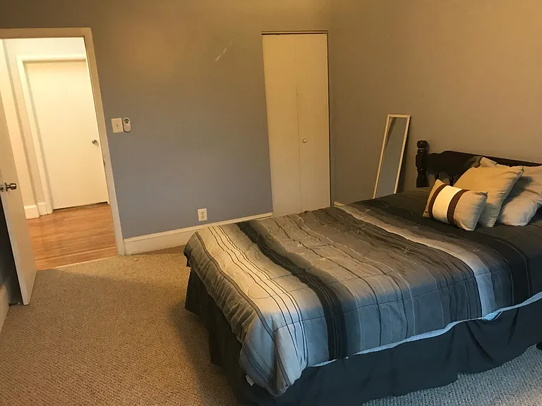 Furnished second bedroom with full-sized bed